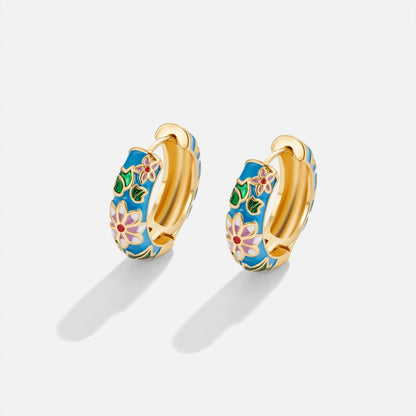 Goldene Kreolenohrringe mit Blume