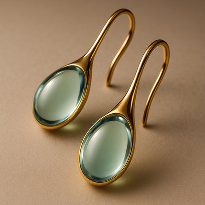Hängende Kristallohrringe in Gold und Silber